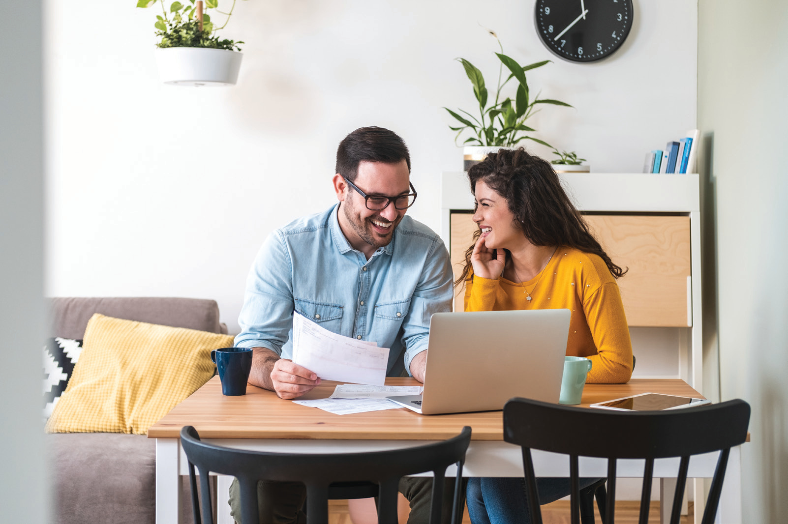Two people working through mortgage paperwork together